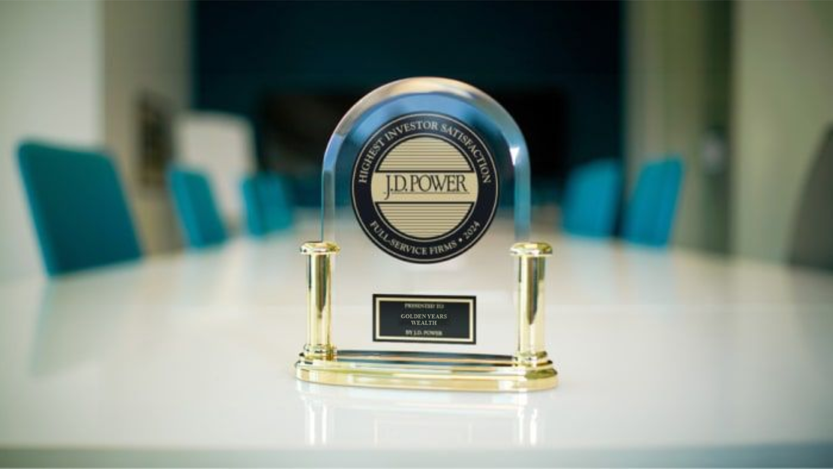 Three individuals having a discussion around a laptop